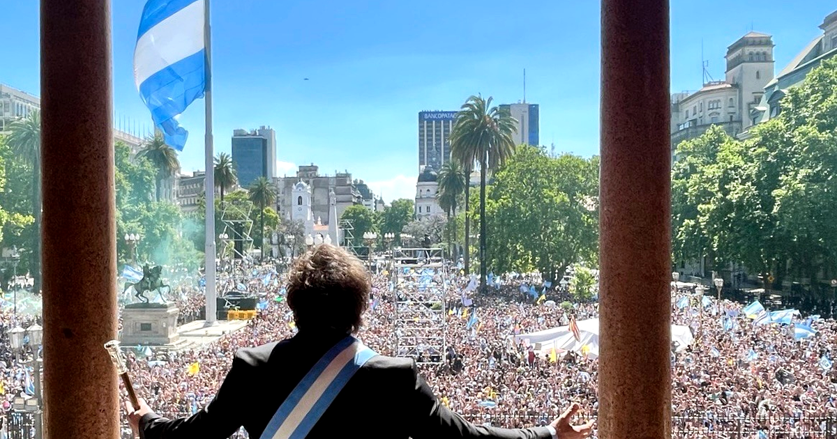 Archive photo of Javier Milei, seen from behind in the presidential sash, facing the crowd in the Plaza de Mayo in December 2023
