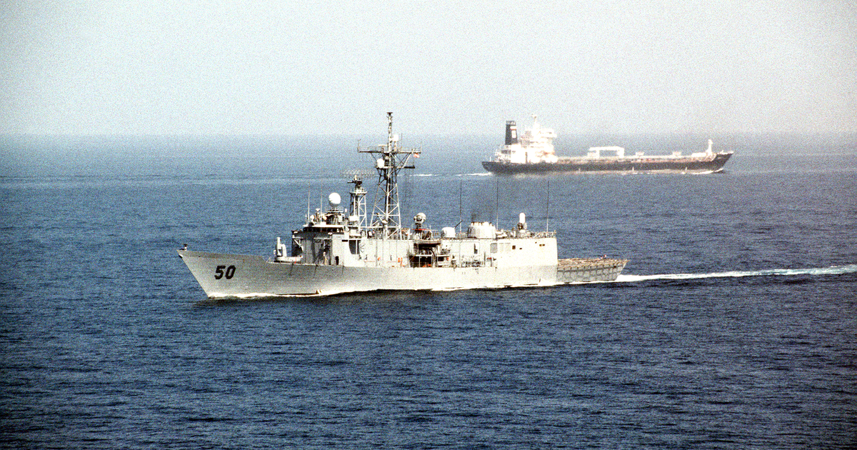 USS Taylor (FFG-50) passes an oil tanker after transit of the Strait of Hormuz during Operation Desert Shield. U.S. Department of Defense photograph. Public domain.