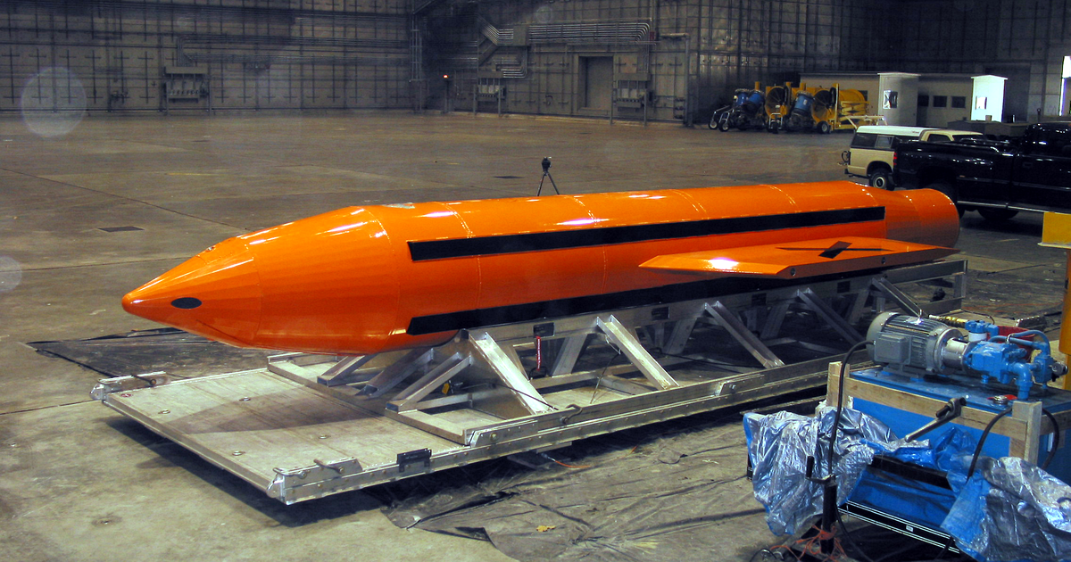 An orange GBU-43/B MOAB bomb on a metal cradle inside a hangar at Eglin Air Force Base, Florida, in 2003 (file photo).