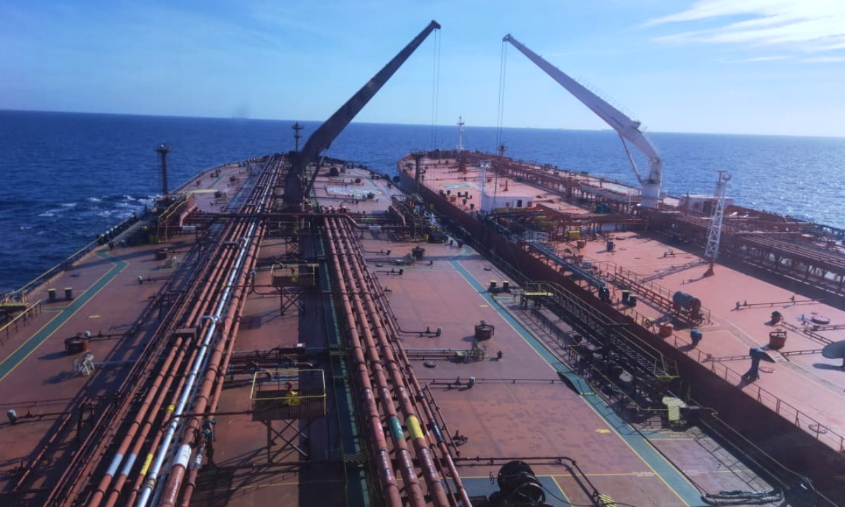 Archival photograph, 3 May 2020: ship-to-ship oil-transfer operations alongside a Suezmax tanker. Photograph: Martian-2007 via Wikimedia Commons. CC BY-SA 4.0.